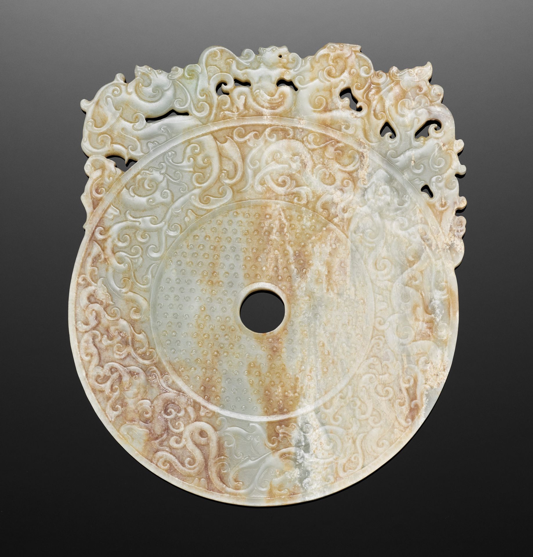 AN ARCHAISTIC BI DISC WITH PHOENIXES AND CHILONG