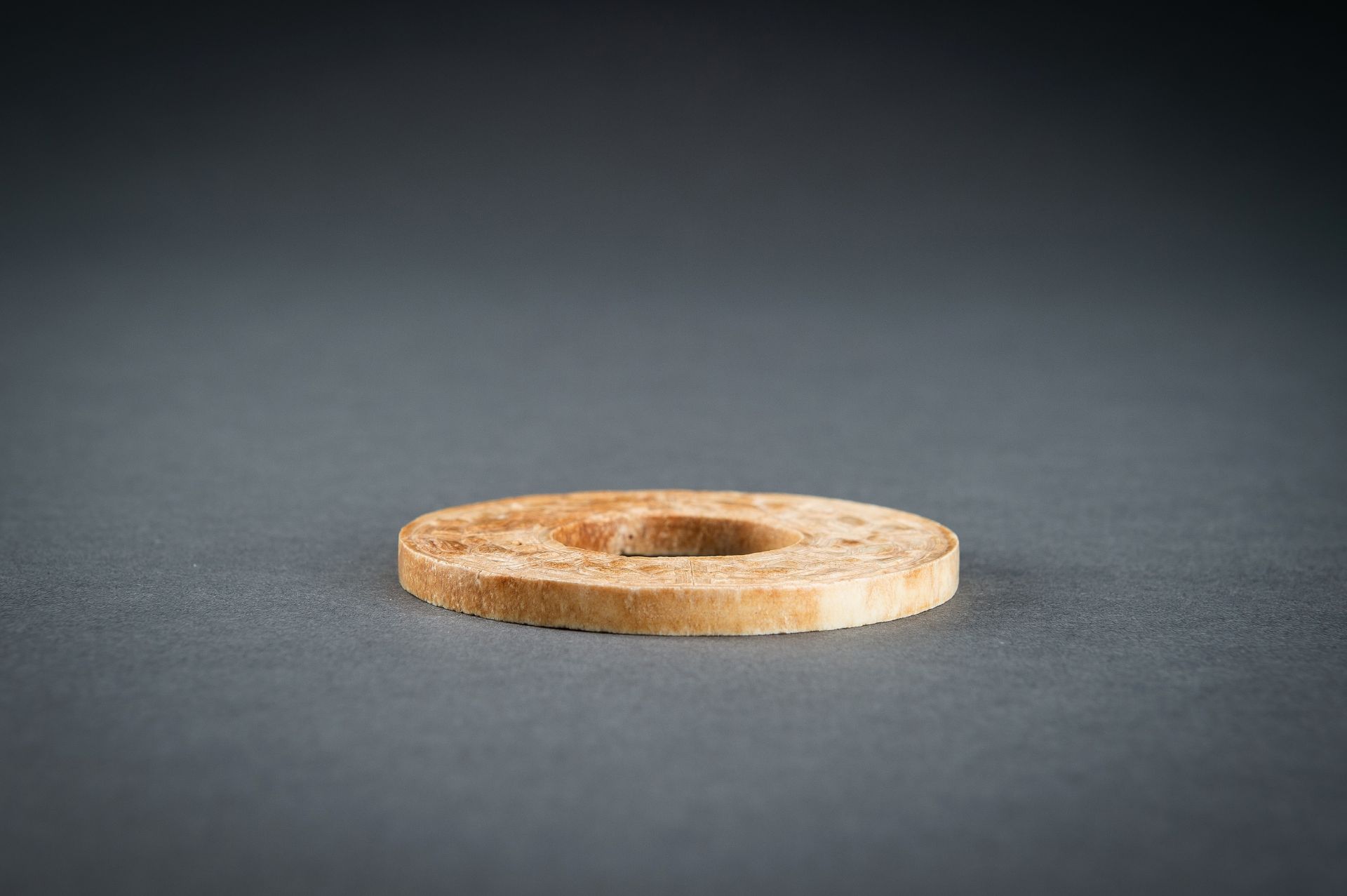 A SMALL OCHRE JADE ARCHAISTIC BI DISC, QING - Image 15 of 15