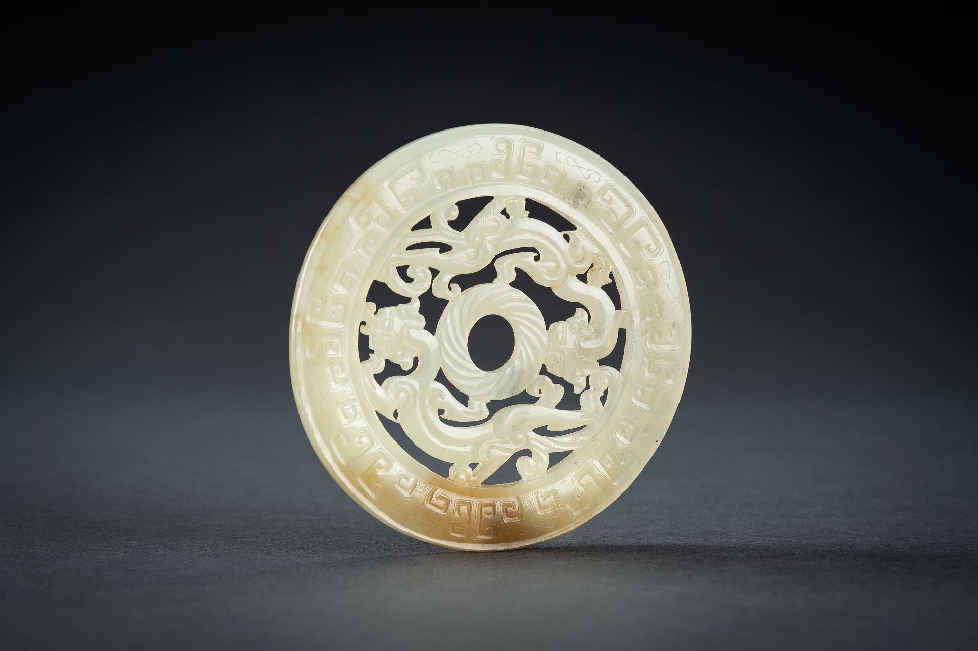 AN ARCHAISTIC YELLOW JADE RETICULATED 'CHILONG' BI DISC, QING - Image 10 of 15