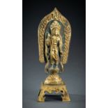 AN ARCHAISTIC FIRE-GILT COPPER REPOUSSÃ‰ FIGURE OF A BODHISATTVA