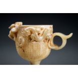 AN ARCHAISTIC CELADON JADE 'CHILONG' WINE CUP