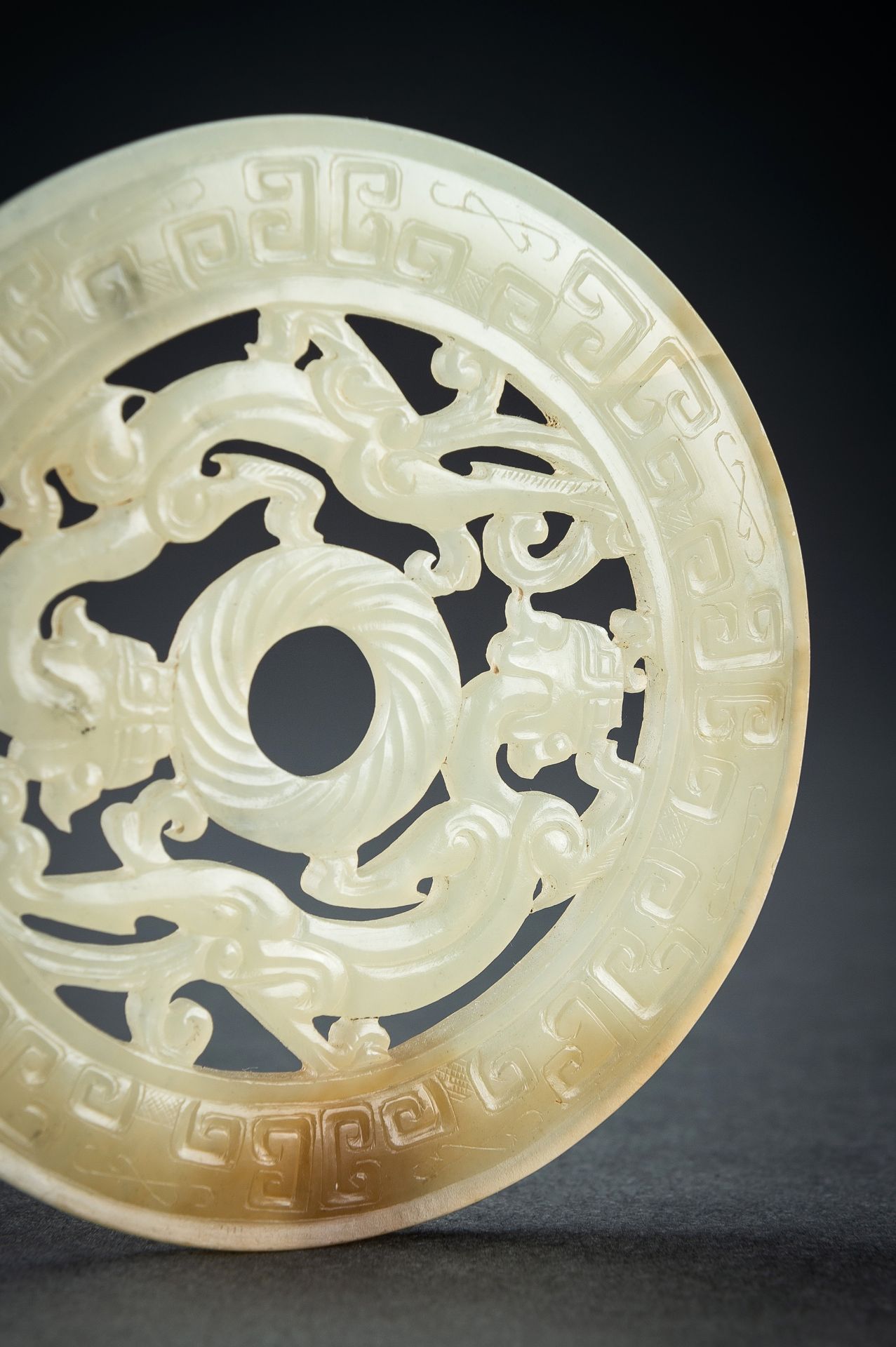 AN ARCHAISTIC YELLOW JADE RETICULATED 'CHILONG' BI DISC, QING - Image 6 of 15