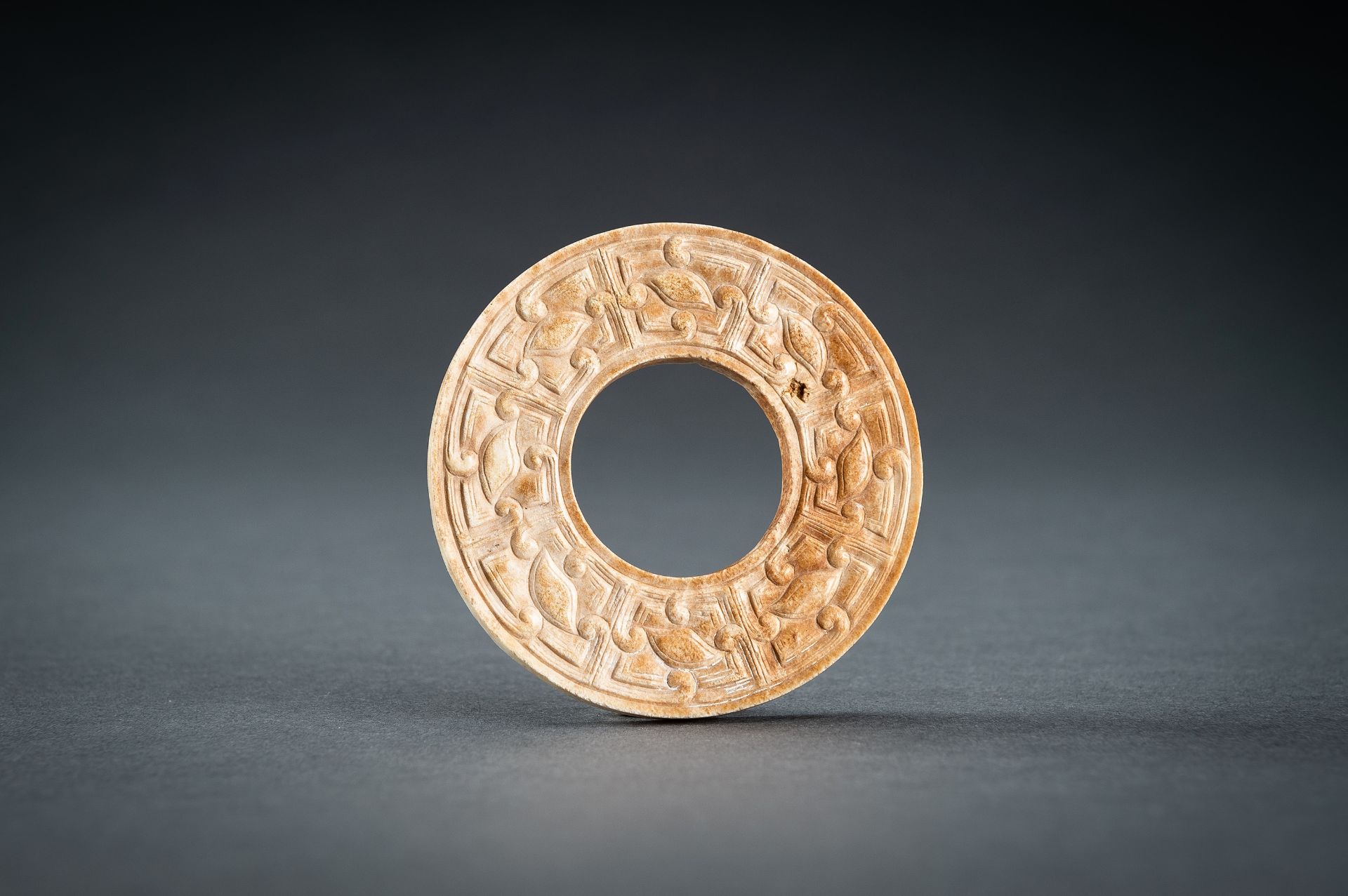 A SMALL OCHRE JADE ARCHAISTIC BI DISC, QING - Image 2 of 15