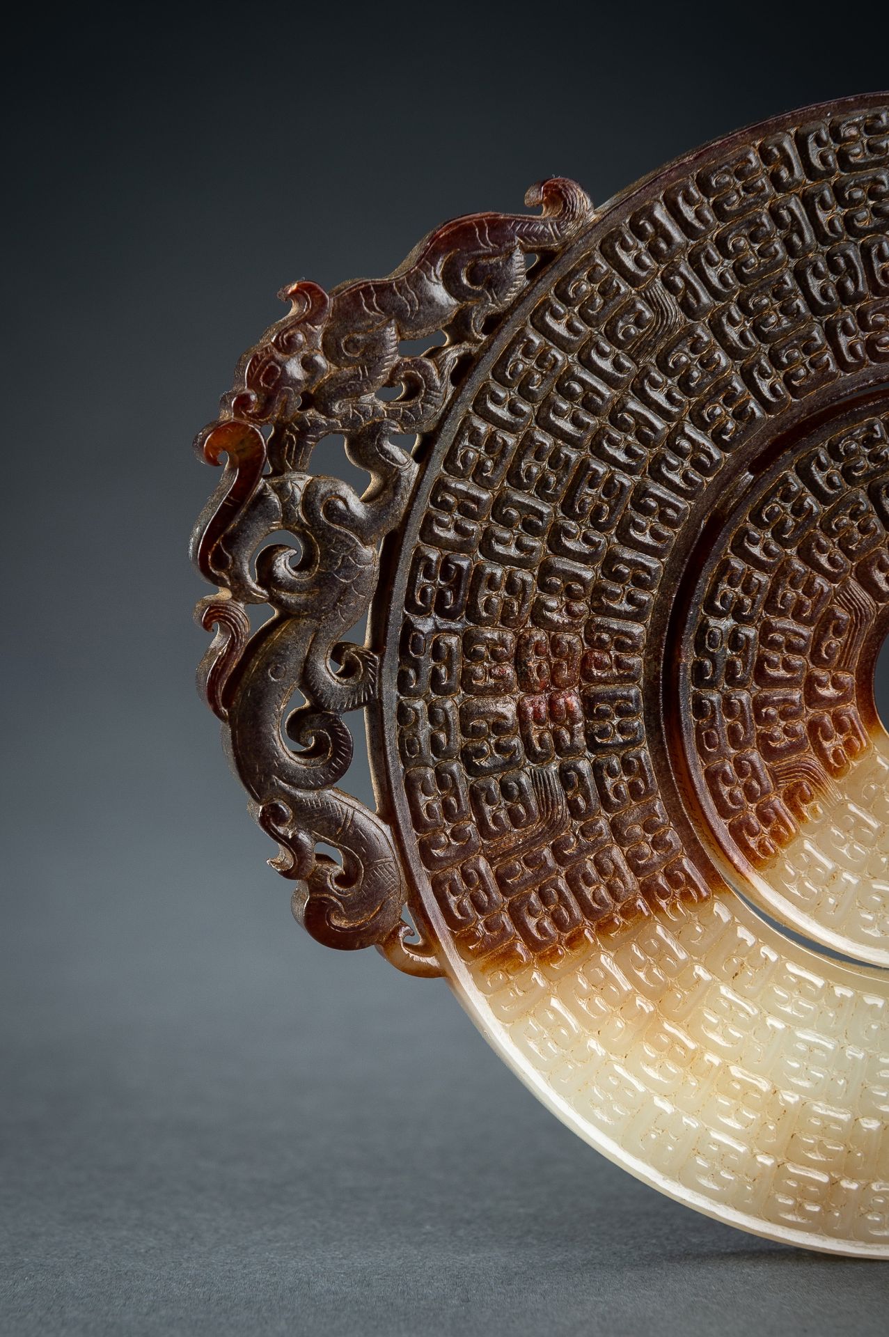 AN ARCHAISTIC WHITE AND BROWN JADE DOUBLE BI DISC, QING - Image 9 of 15