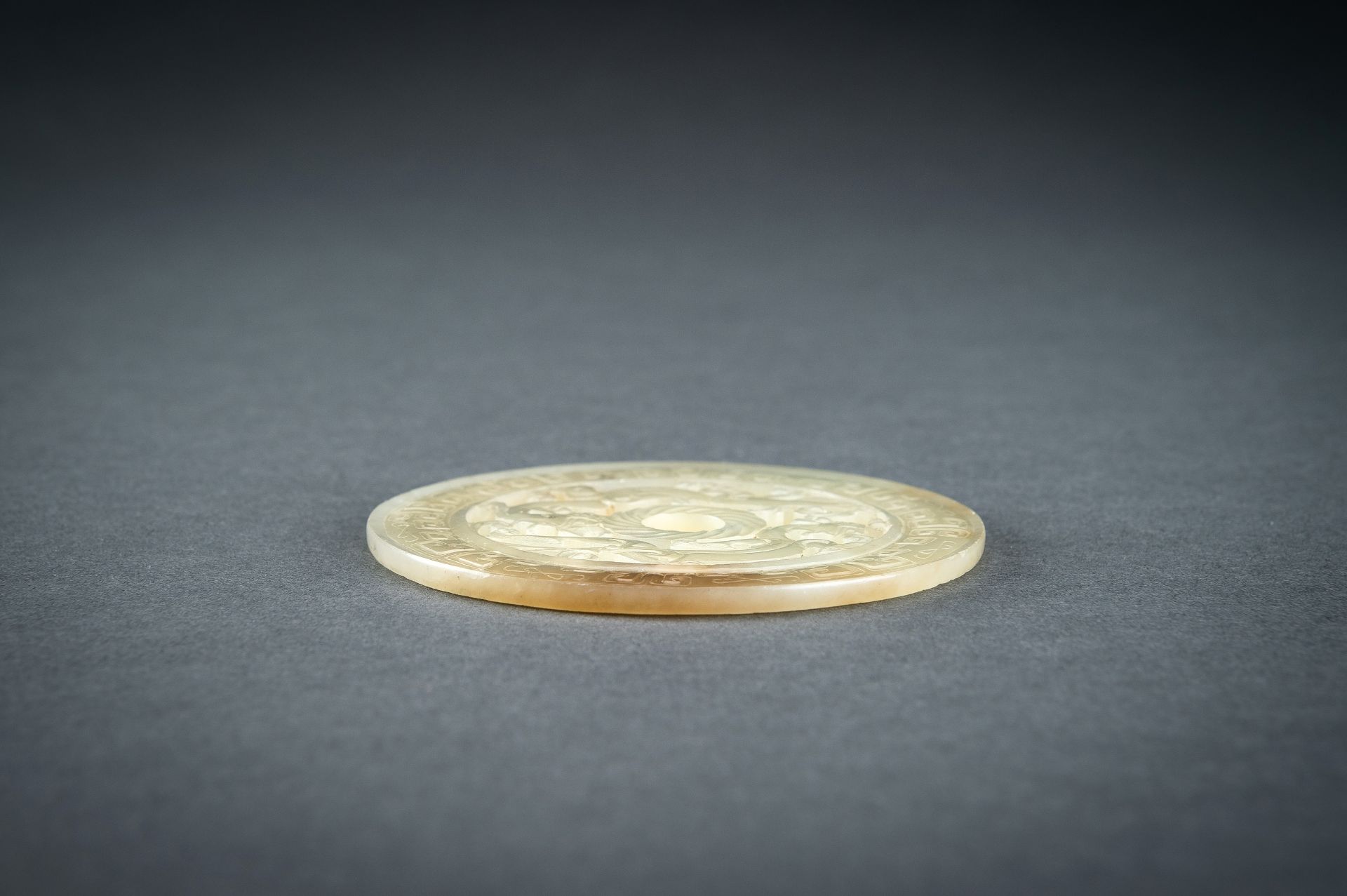 AN ARCHAISTIC YELLOW JADE RETICULATED 'CHILONG' BI DISC, QING - Image 12 of 15