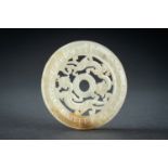 AN ARCHAISTIC YELLOW JADE RETICULATED 'CHILONG' BI DISC, QING