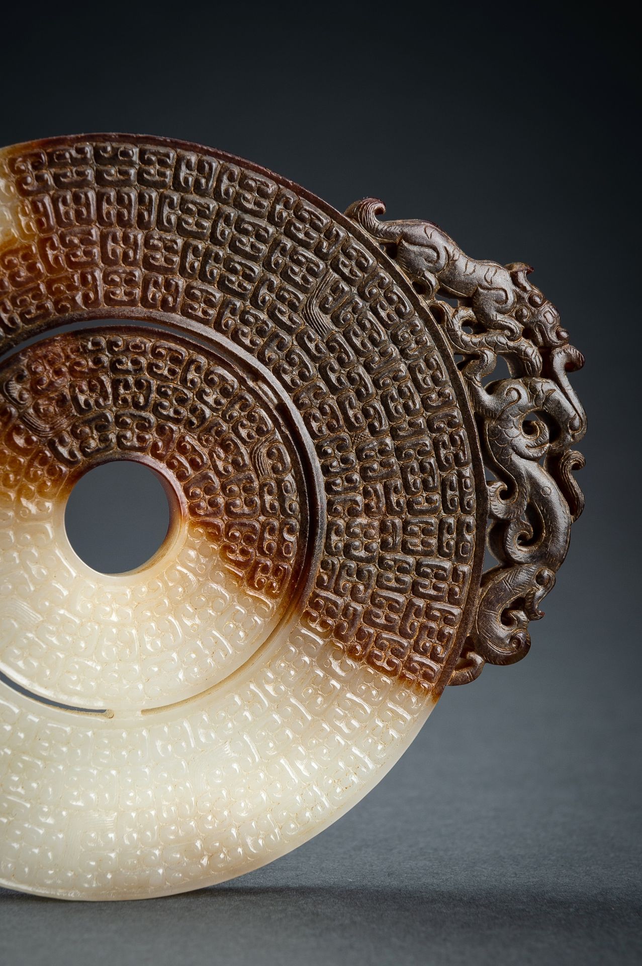 AN ARCHAISTIC WHITE AND BROWN JADE DOUBLE BI DISC, QING - Image 4 of 15