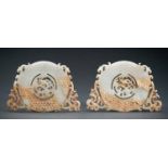 A PAIR OF ARCHAISTIC WHITE AND RUSSET JADE 'PHOENIXES AND DRAGON' BI DISCS