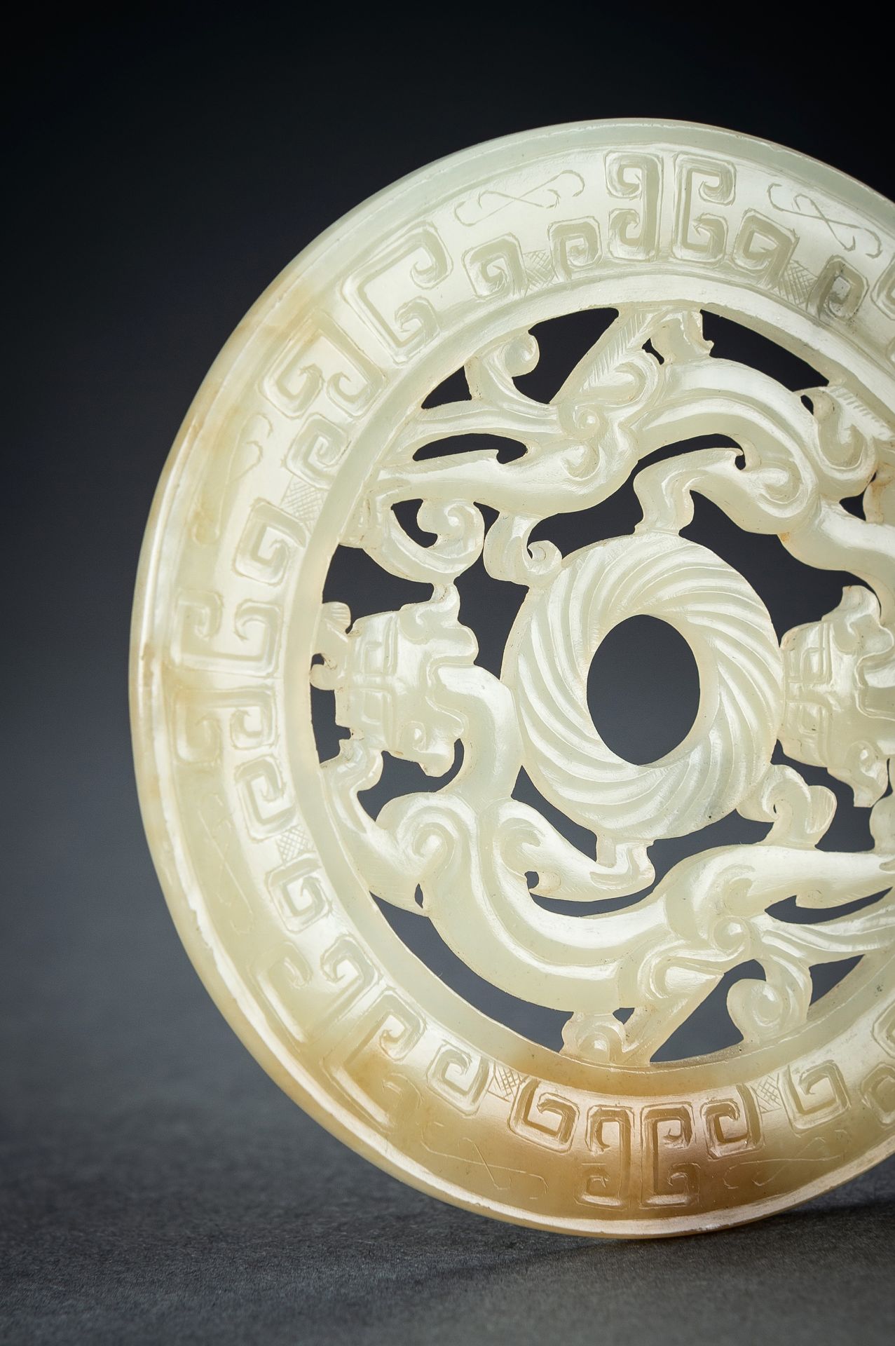 AN ARCHAISTIC YELLOW JADE RETICULATED 'CHILONG' BI DISC, QING - Image 5 of 15