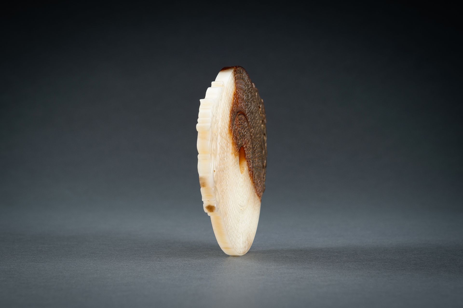 AN ARCHAISTIC WHITE AND BROWN JADE DOUBLE BI DISC, QING - Image 5 of 15