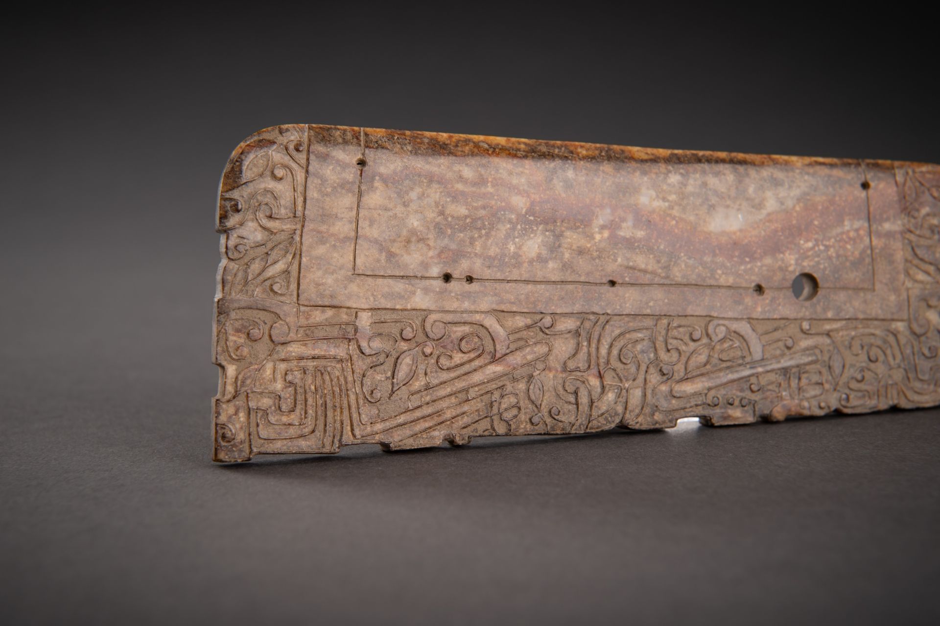 A FINELY DECORATED BROWN JADE AXE, QING - Image 7 of 13