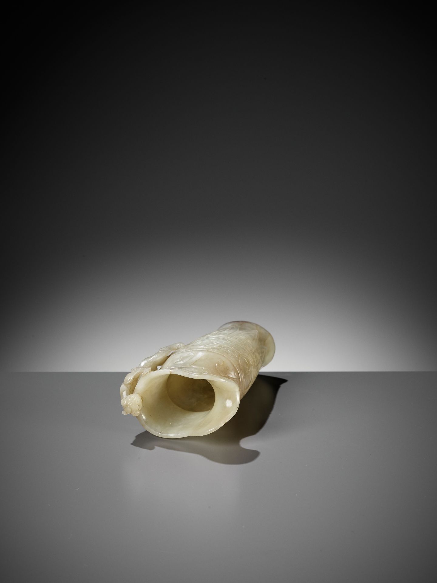 AN IMPERIAL CELADON AND RUSSET JADE 'CHILONG' RHYTON, QIANLONG MARK AND PERIOD - Image 15 of 17