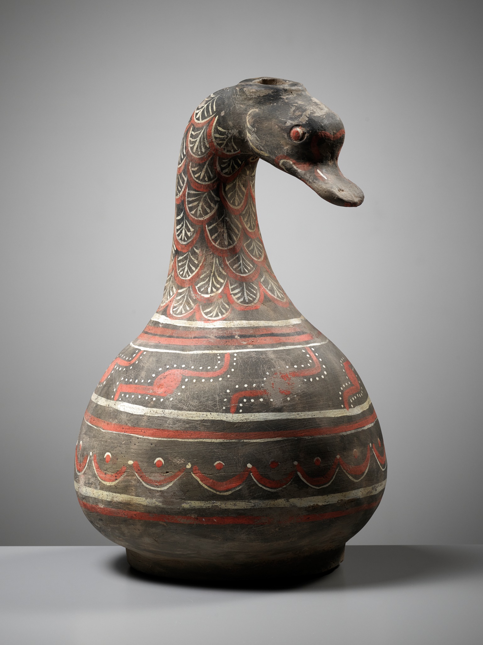 A DUCK-HEADED PAINTED POTTERY VESSEL, HAN DYNASTY
