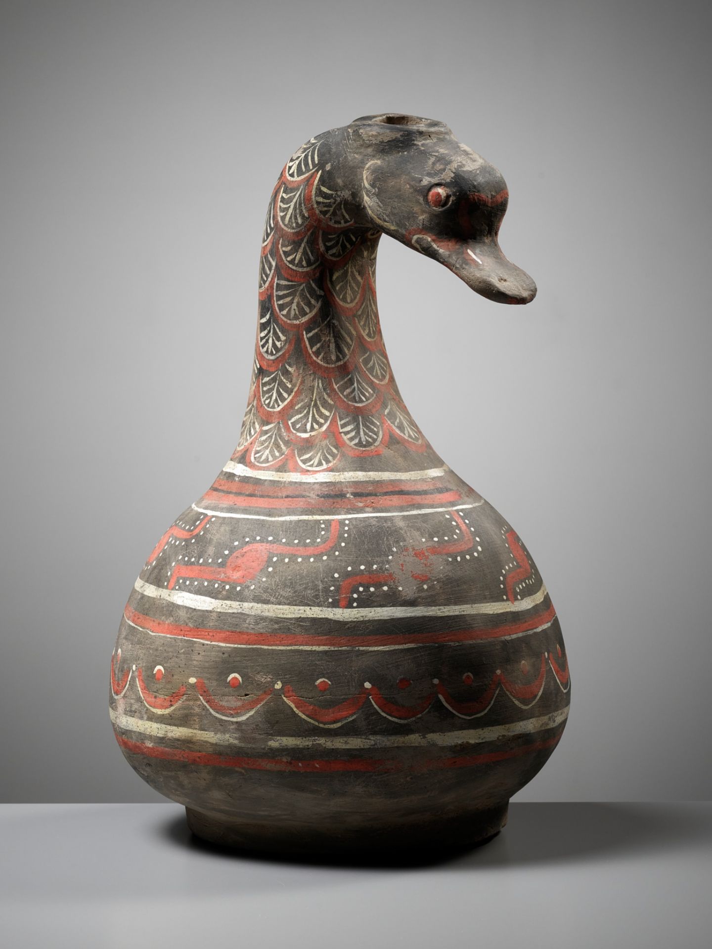 A DUCK-HEADED PAINTED POTTERY VESSEL, HAN DYNASTY