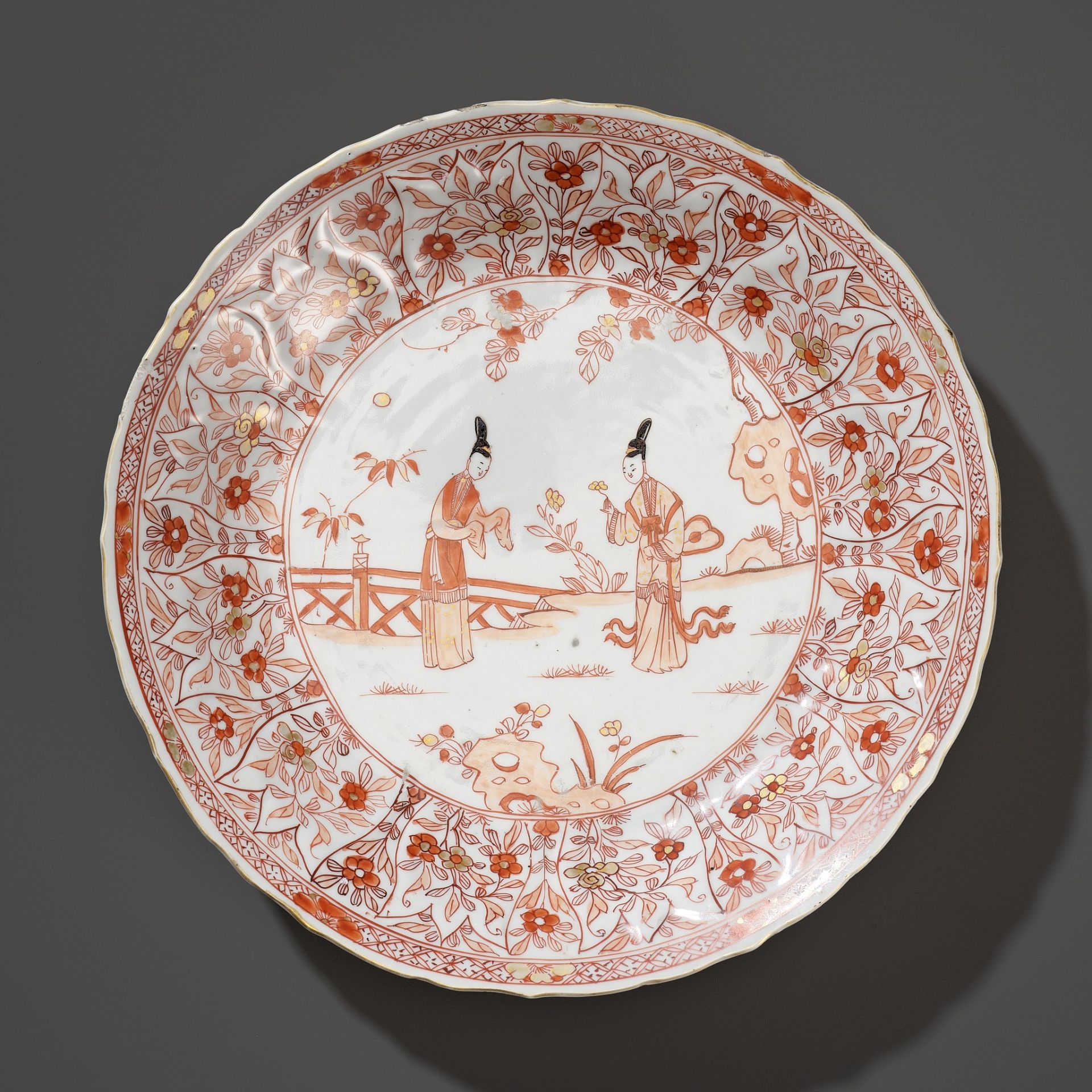 A BARBED-RIM IRON-RED AND GILT-DECORATED 'LADIES' DISH, KANGXI PERIOD