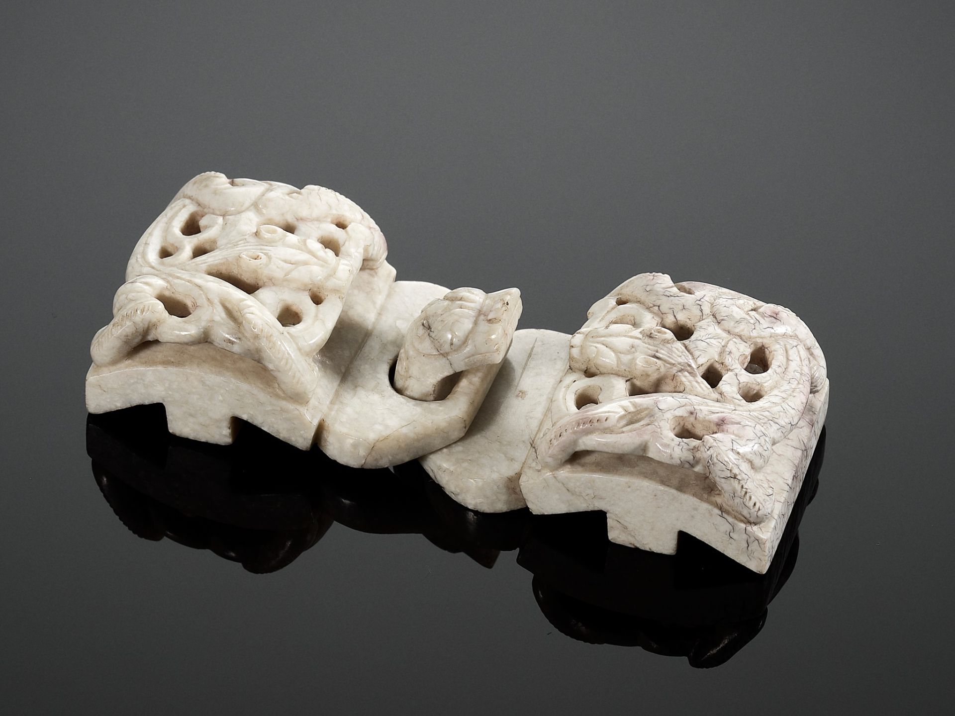 A CHICKEN BONE JADE 'CHILONG' BELT HOOK AND BUCKLE, MING DYNASTY