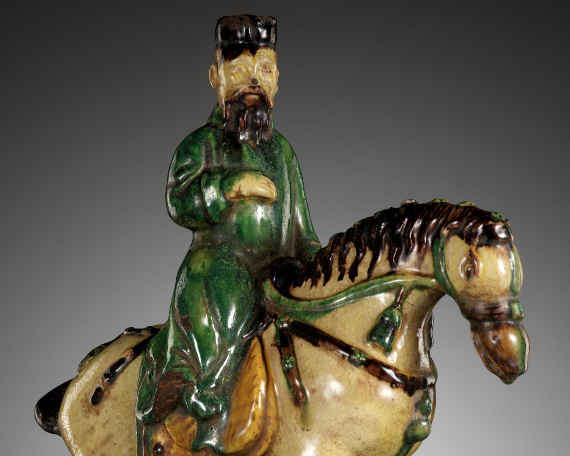 A SANCAI GLAZED EQUESTRIAN-FORM ROOF TILE, MING DYNASTY