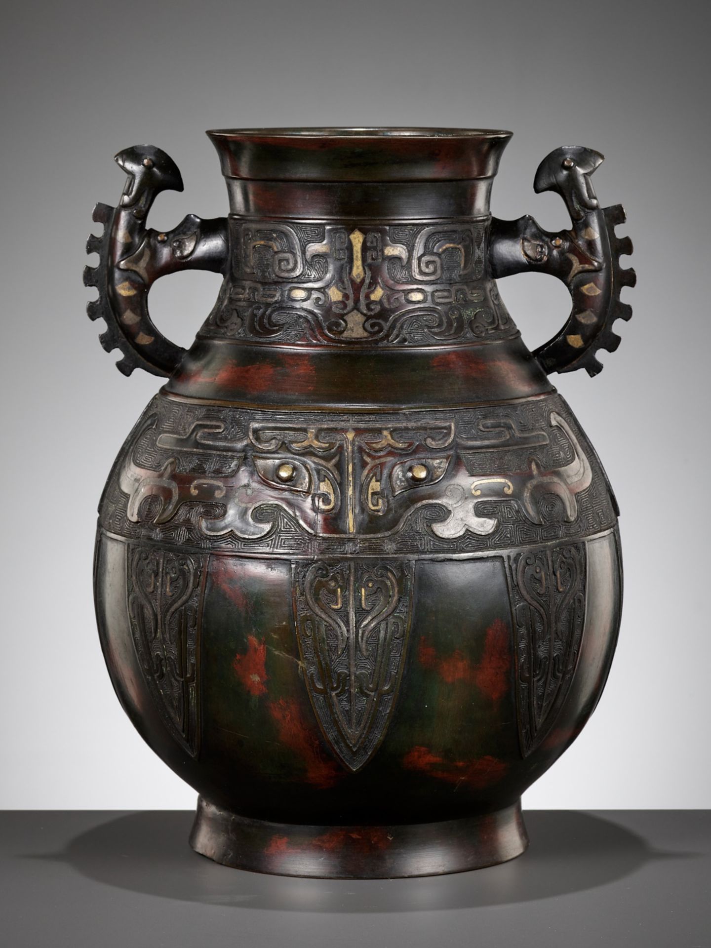 A LARGE ARCHAISTIC GOLD AND SILVER-INLAID BRONZE VASE, HU, QING DYNASTY