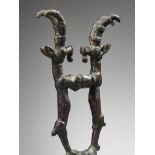 A LURISTAN BRONZE 'DOUBLE IBEX' FINIAL, IRAN, CIRCA 1350-1000 BC