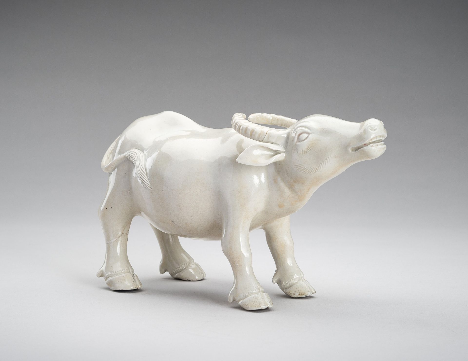 A DEHUA FIGURE OF AN OX, QING DYNASTY