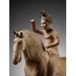 A PAINTED POTTERY FIGURE OF A POLO PLAYER, SUI TO TANG DYNASTY