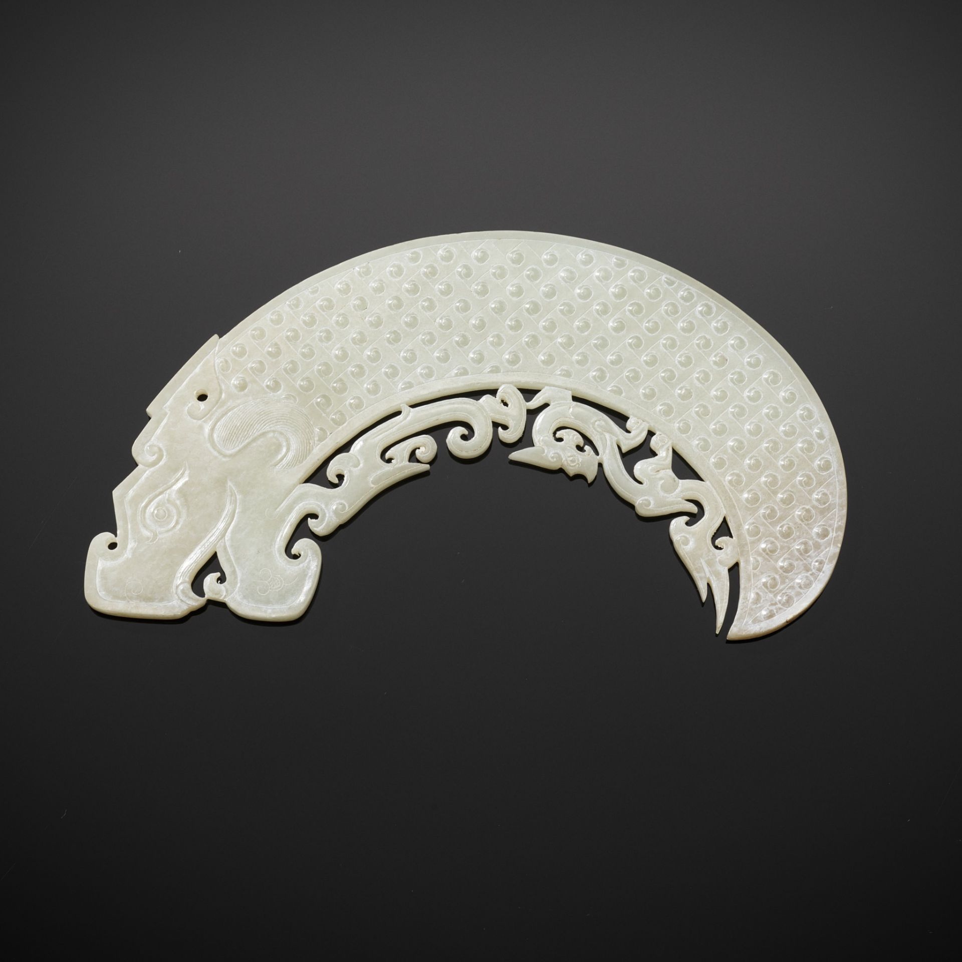 A WHITE JADE 'DRAGON' ORNAMENT, WESTERN HAN