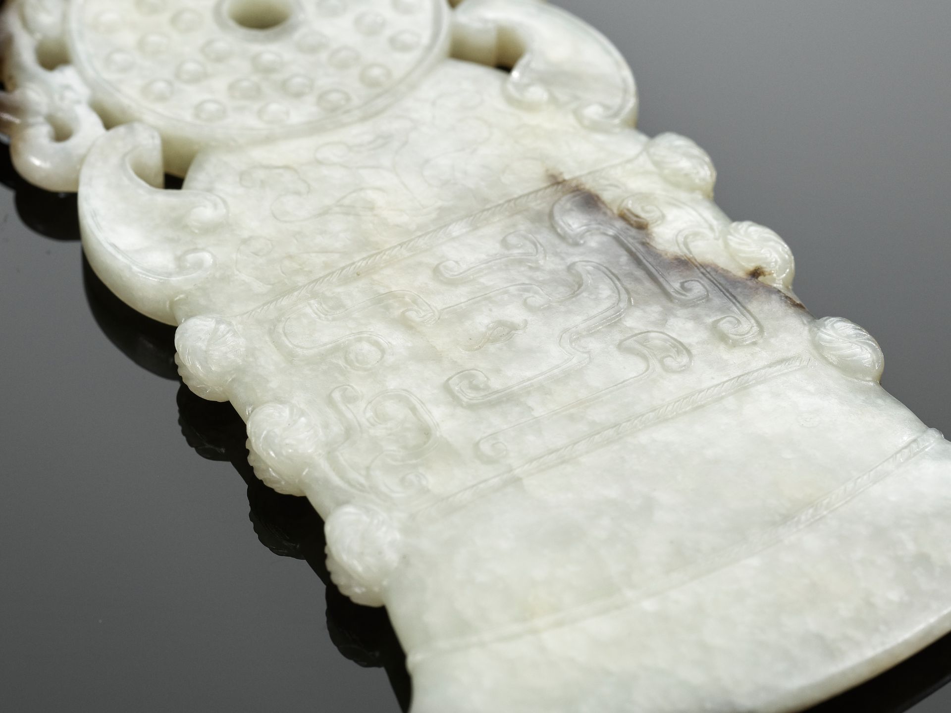 A BLACK AND WHITE JADE 'ARCHAISTIC' AXE-FORM OPENWORK PENDANT, 18TH CENTURY - Image 8 of 9