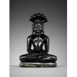 A BLACK STONE FIGURE OF PARSHVANATHA, JAIN, 15TH-17TH CENTURY