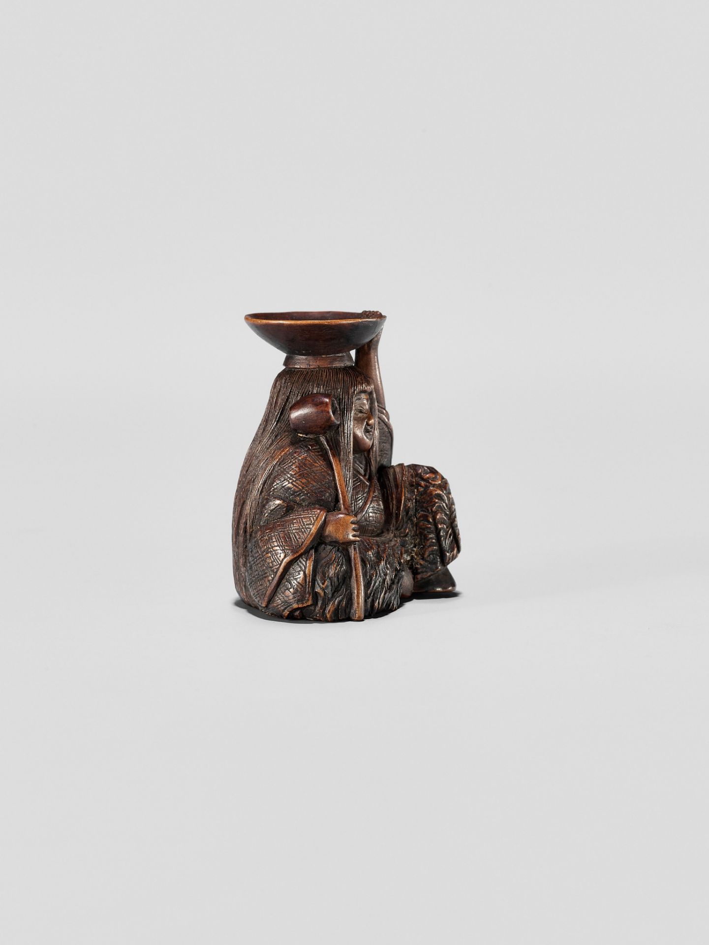 HIDEHARU: A NAGOYA SCHOOL WOOD NETSUKE OF A DRUNKEN SHOJO WITH LADLE AND SAKE SAUCER - Image 6 of 11