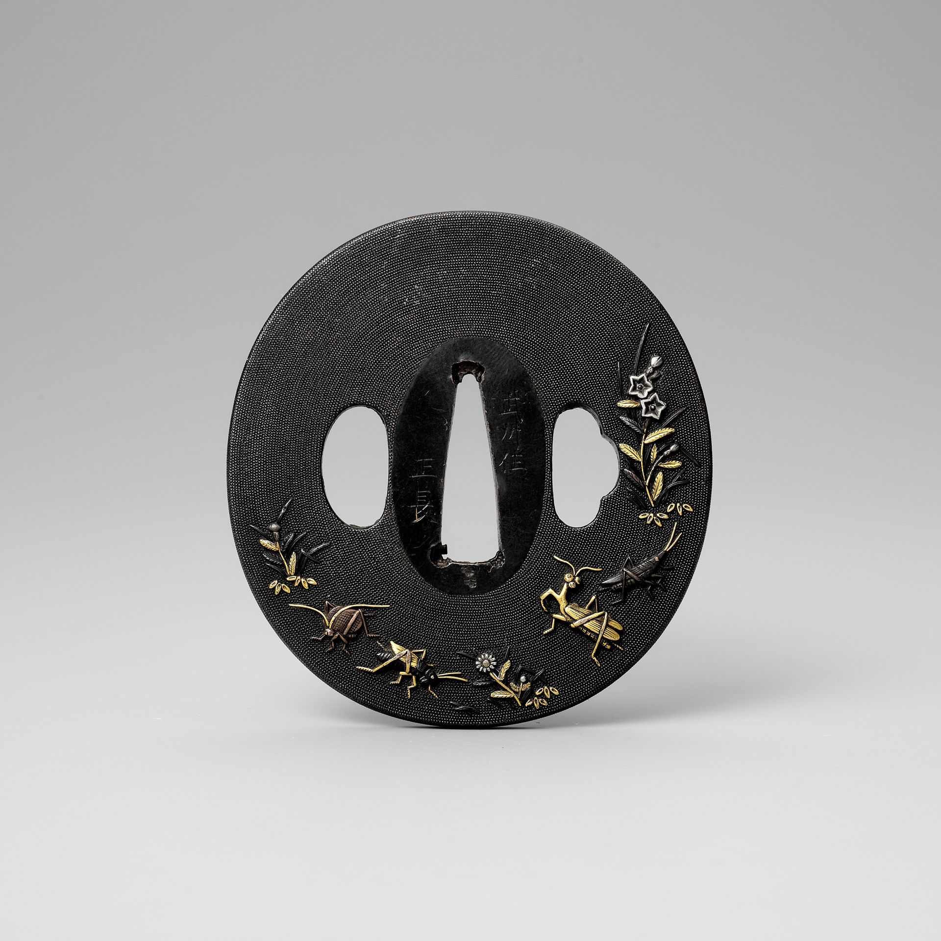 MASANAGA: A FINE SHAKUDO NANAKO TSUBA WITH AUTUMN PLANTS AND INSECTS