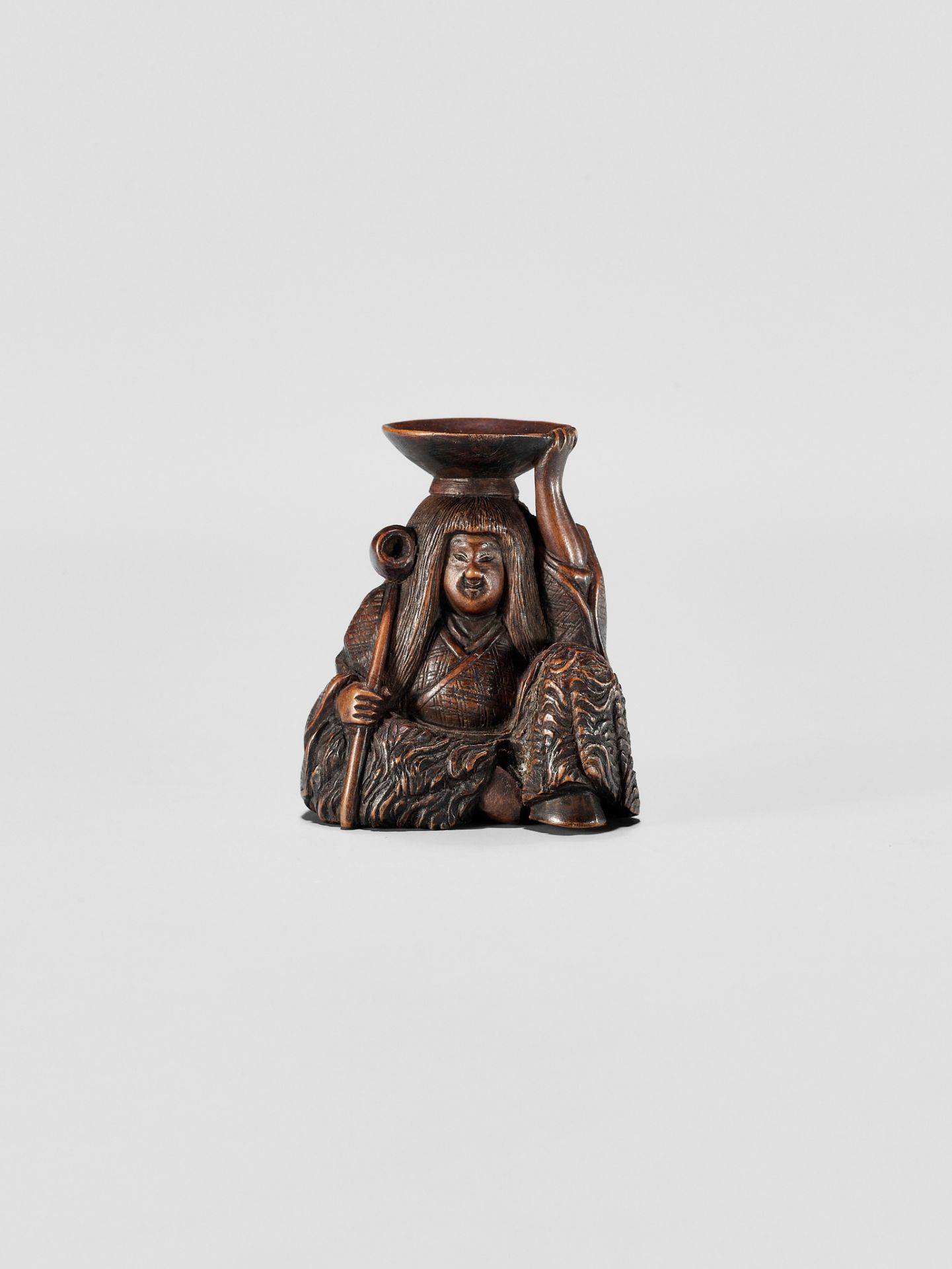 HIDEHARU: A NAGOYA SCHOOL WOOD NETSUKE OF A DRUNKEN SHOJO WITH LADLE AND SAKE SAUCER - Image 2 of 11