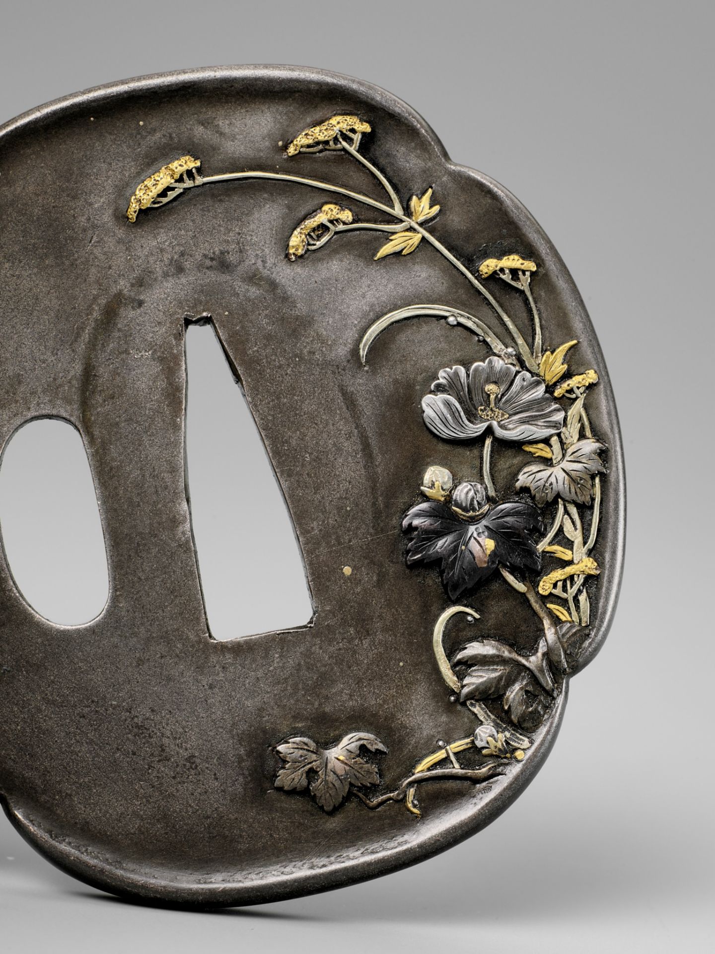 RYUMEISHI KAZUHIDE: A FINE SHIBUICHI TSUBA WITH SPRING FLOWERS AFTER RAIN - Image 3 of 4