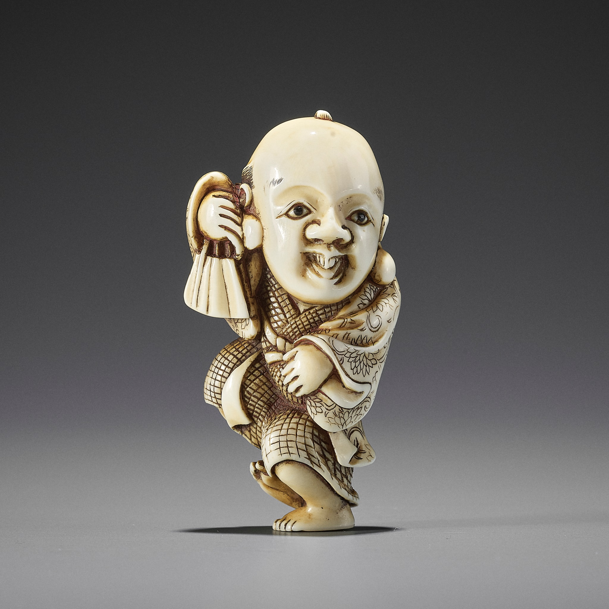 YOSHIMASA: AN IVORY NETSUKE OF FUKUSUKE