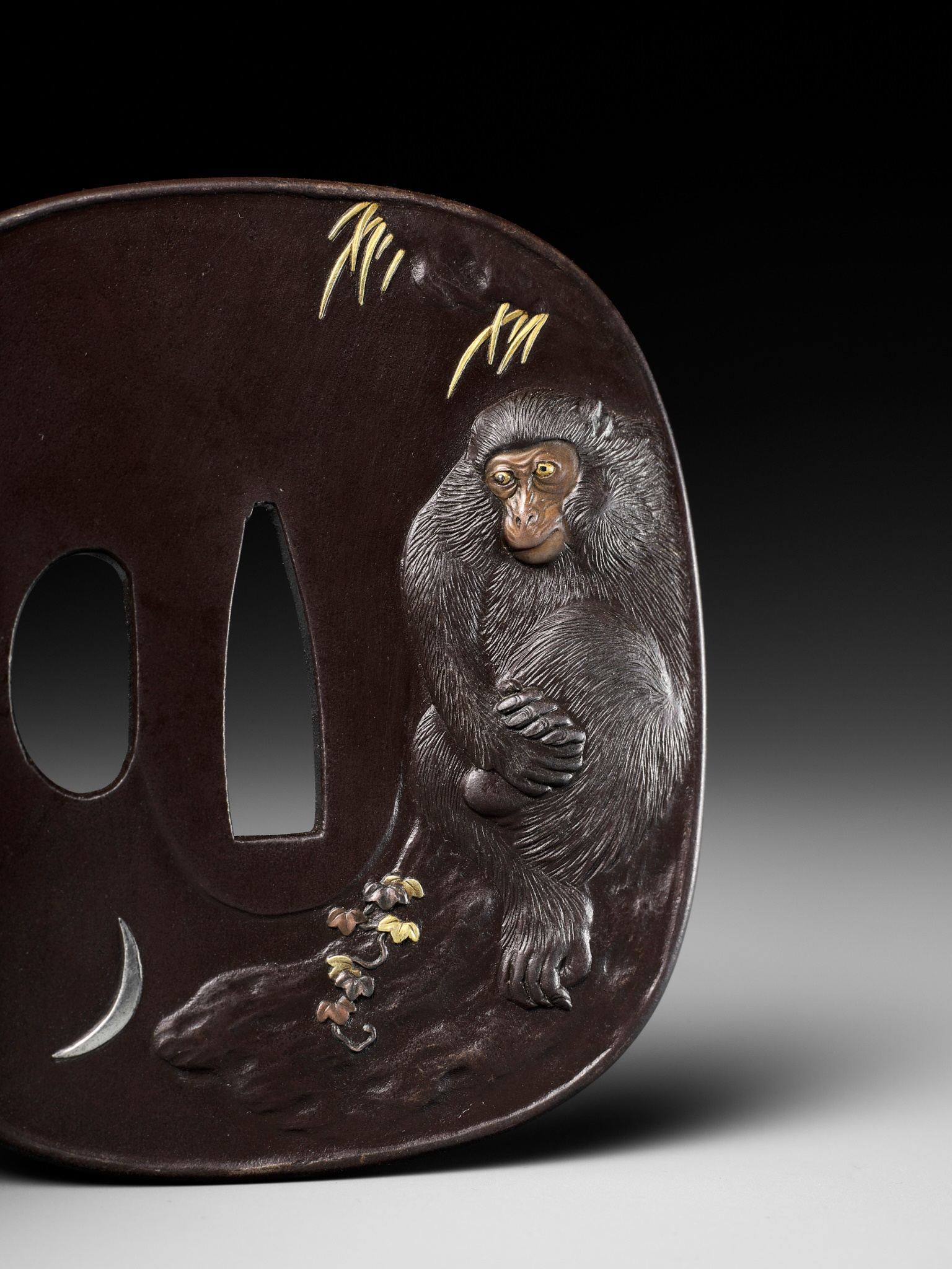 HAMANO NORIYUKI II: A MASTERFUL IRON TSUBA DEPICTING A MONKEY AND CRESCENT MOON