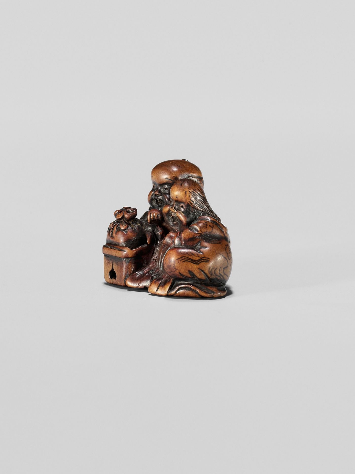 HIDESADA: A FINE WOOD NETSUKE OF OKAME AND FUKUSUKE - Image 3 of 12