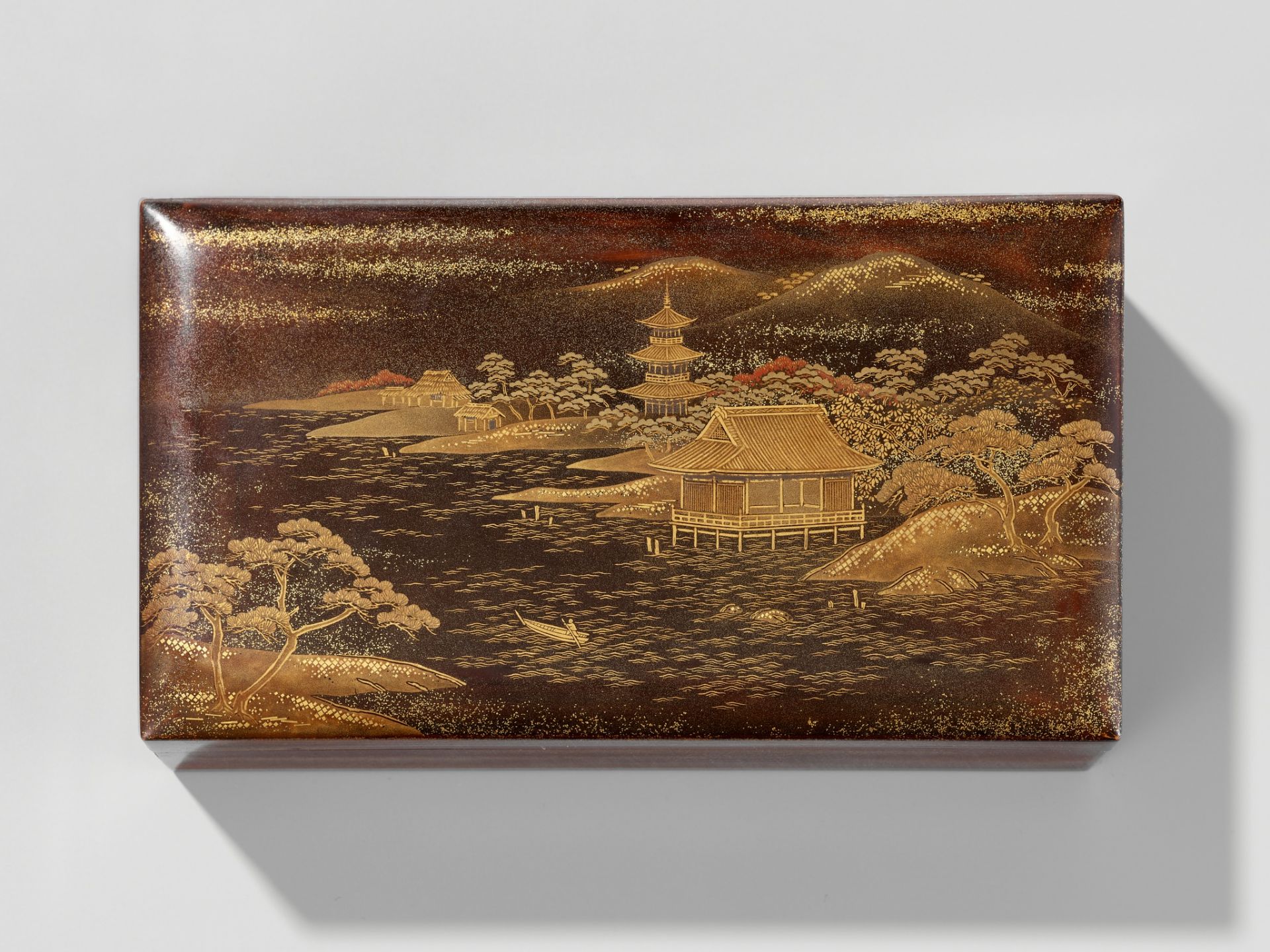 ZOHIKO: A LACQUER KOBAKO (SMALL BOX) AND COVER DEPICTING A SEASHORE LANDSCAPE WITH PAGODA