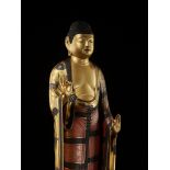 A VERY LARGE GILT AND LACQUERED ANNAMI SCHOOL WOOD FIGURE OF AMIDA NYORAI