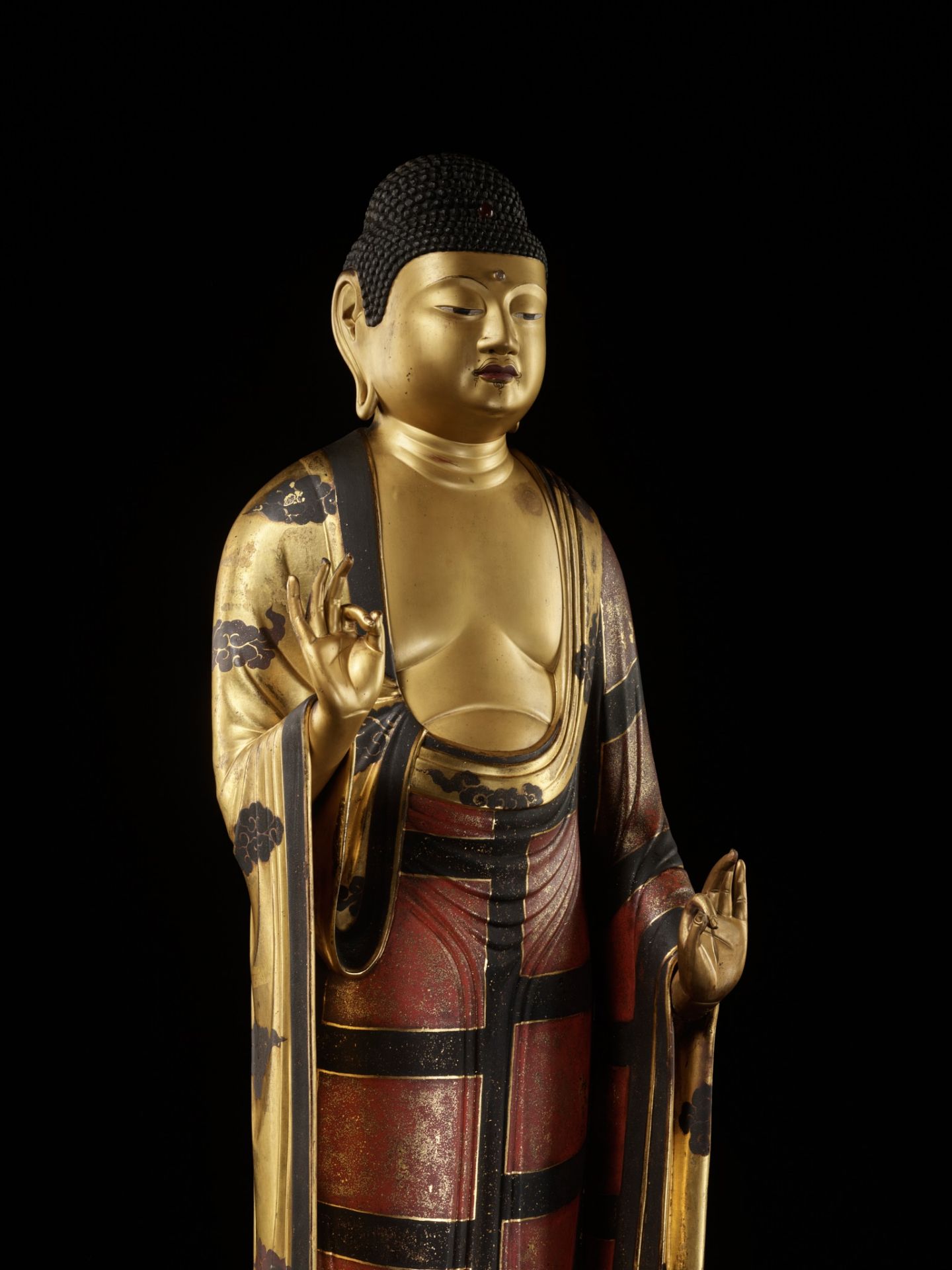 A VERY LARGE GILT AND LACQUERED ANNAMI SCHOOL WOOD FIGURE OF AMIDA NYORAI