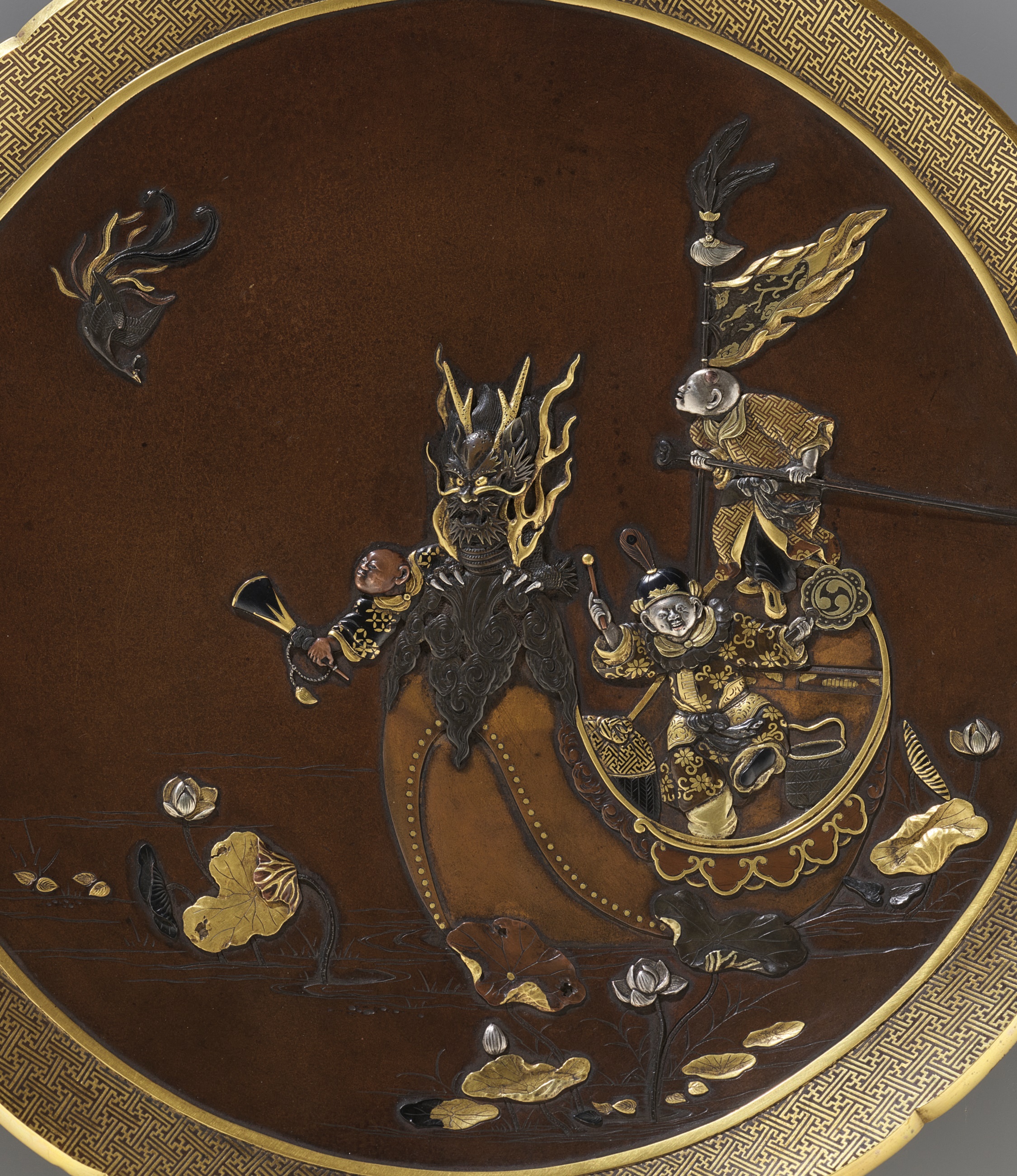 INOUE: A SUPERB INLAID BRONZE DISH DEPICTING BOYS ON A DRAGON BOAT