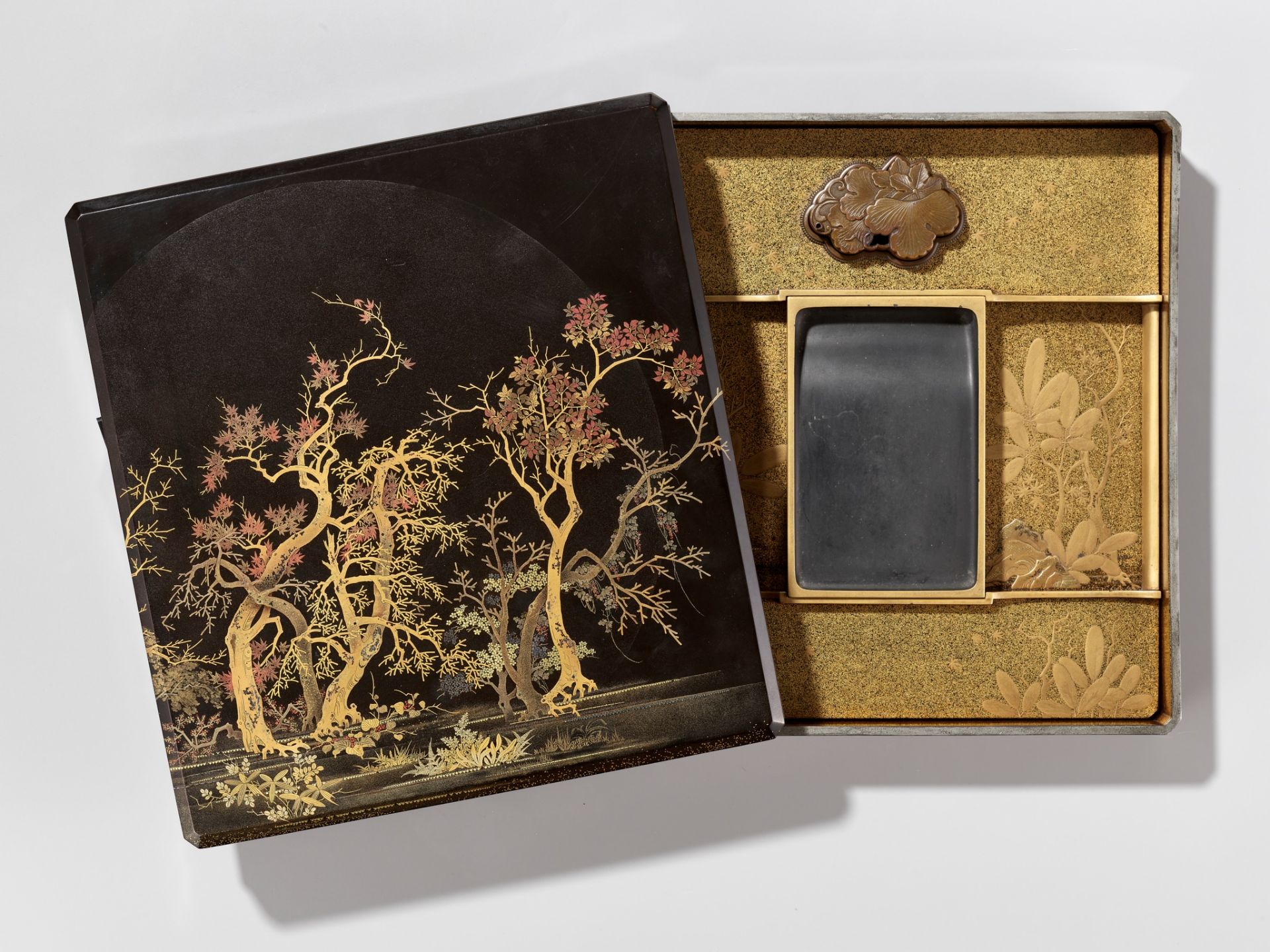 A SUPERB LACQUER SUZURIBAKO (WRITING BOX) DEPICTING A MOONLIT FOREST