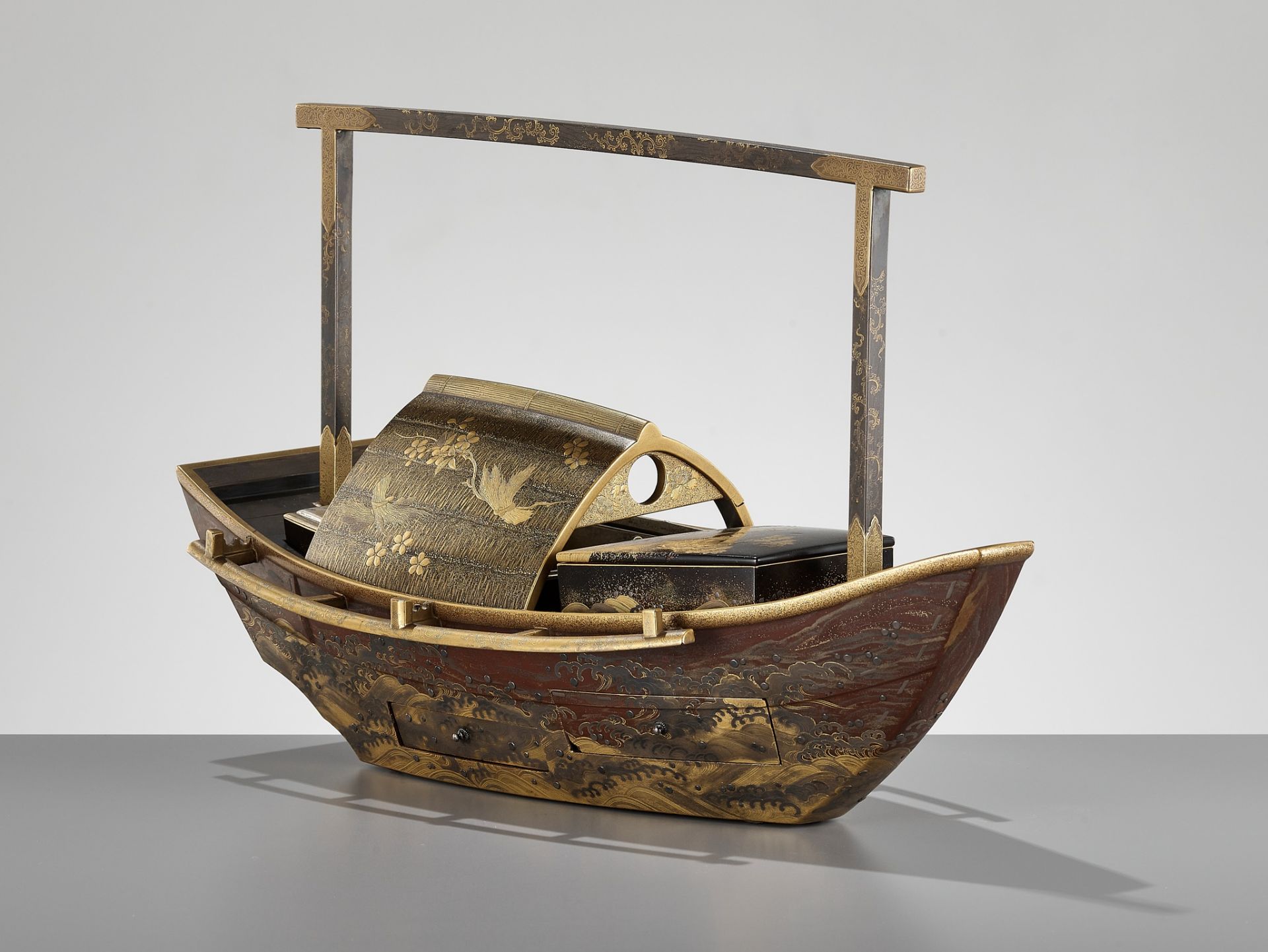 A RARE LACQUER SMOKING SET (TABAKO BON) IN THE FORM OF A BOAT