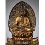 A LARGE AND IMPRESSIVE GILT WOOD FIGURE OF AMIDA NYORAI