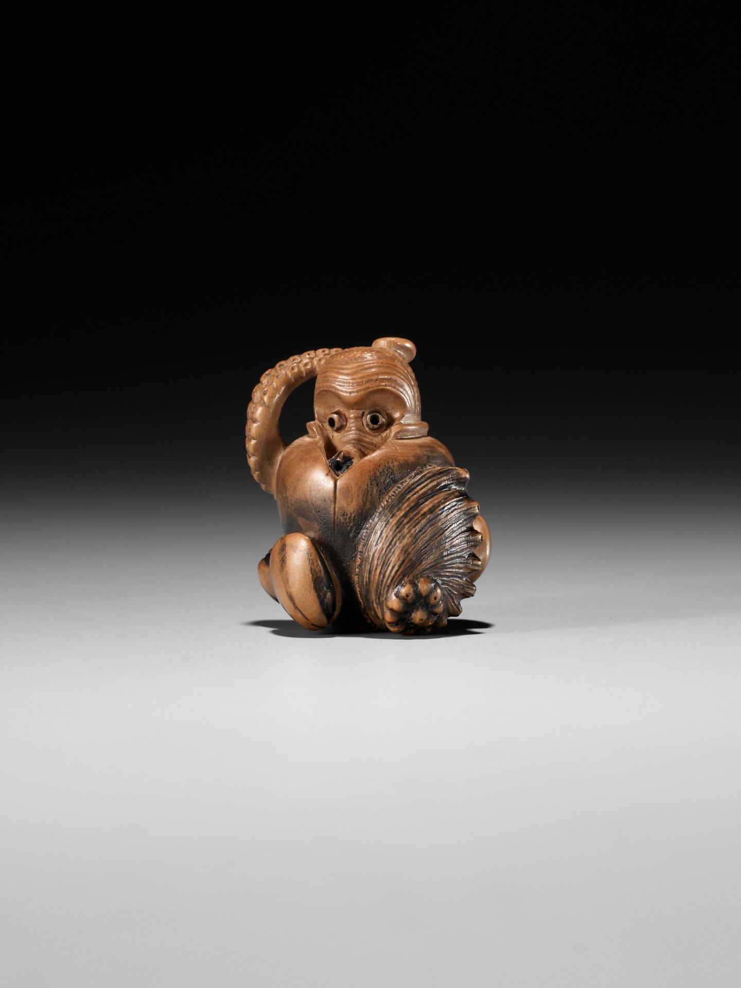 TOMONOBU: A STAINED WOOD NETSUKE OF A TRAPPED OCTOPUS (TAKO TSUBO) - Image 9 of 10