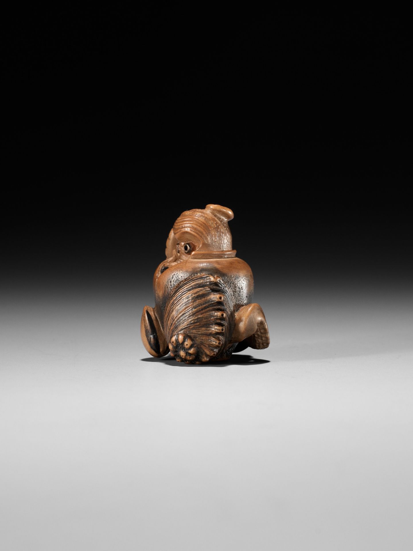 TOMONOBU: A STAINED WOOD NETSUKE OF A TRAPPED OCTOPUS (TAKO TSUBO) - Image 5 of 10