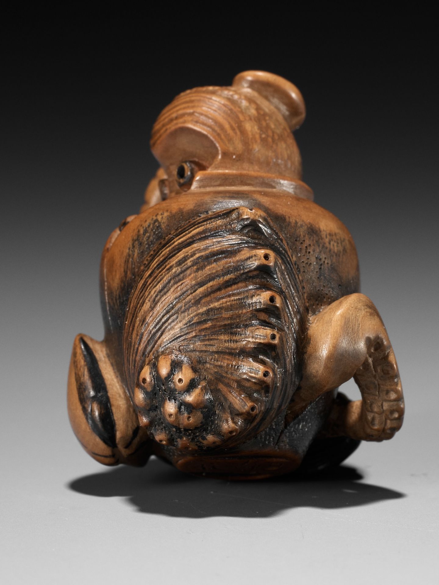 TOMONOBU: A STAINED WOOD NETSUKE OF A TRAPPED OCTOPUS (TAKO TSUBO) - Image 3 of 10