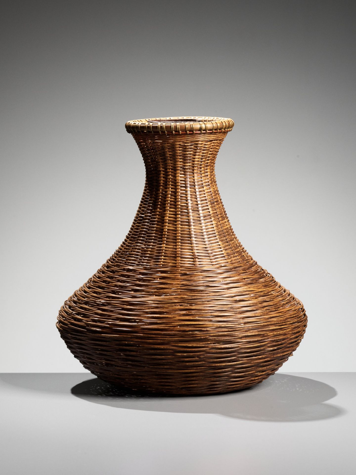 MATSUO CHIKUHO: A WOVEN BAMBOO AND RATTAN HANAKAGO (FLOWER BASKET)