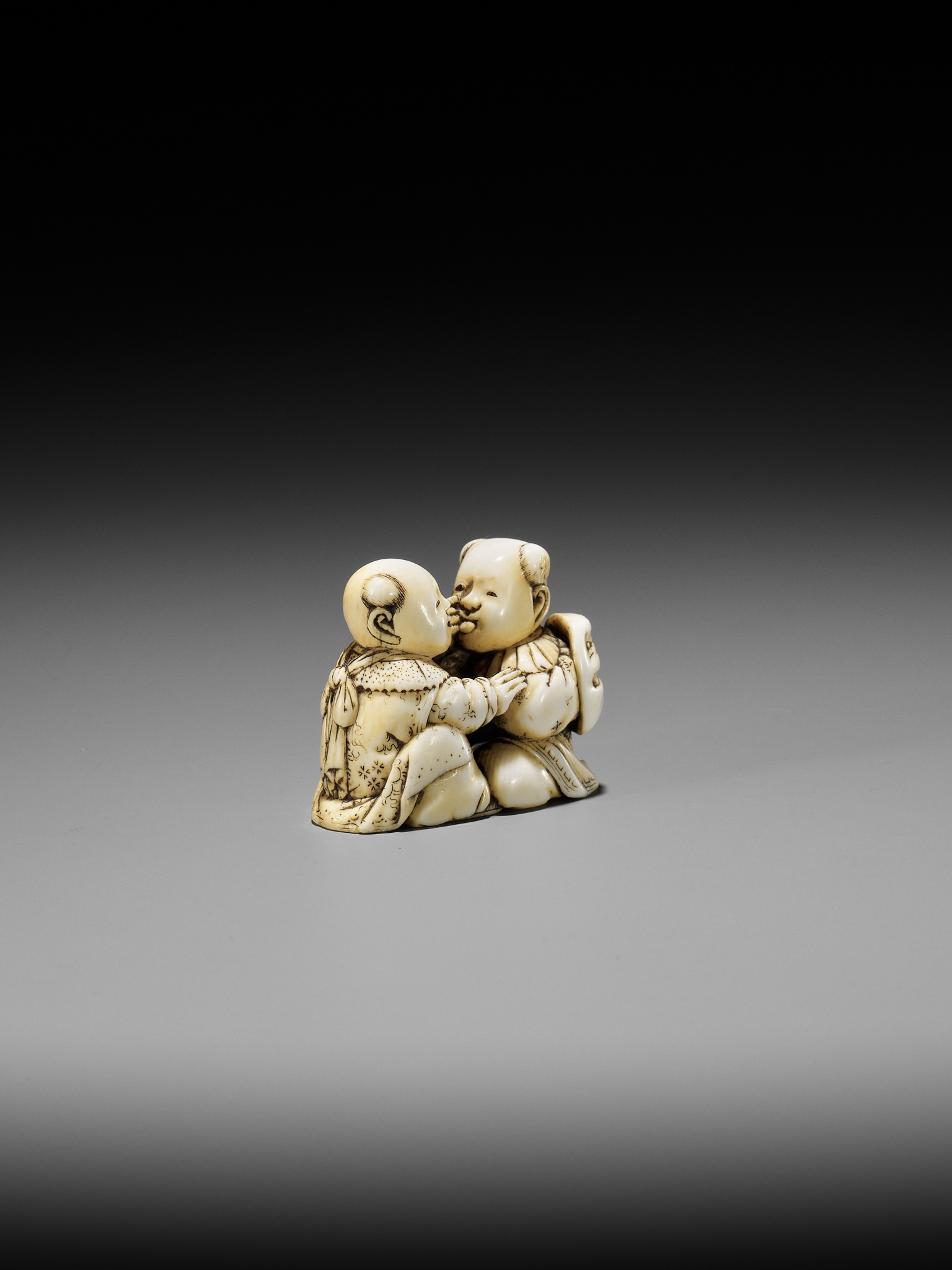 TADACHIKA: AN IVORY NETSUKE OF TWO PLAYING KARAKO - Image 7 of 10