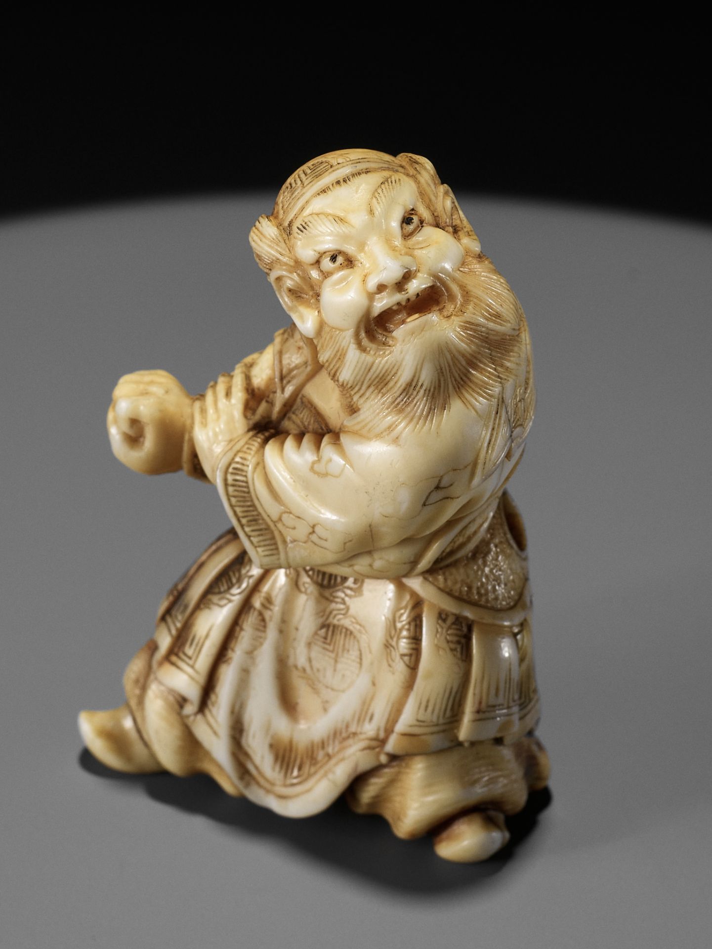 ANRAKU: A FINE IVORY NETSUKE OF SHOKI