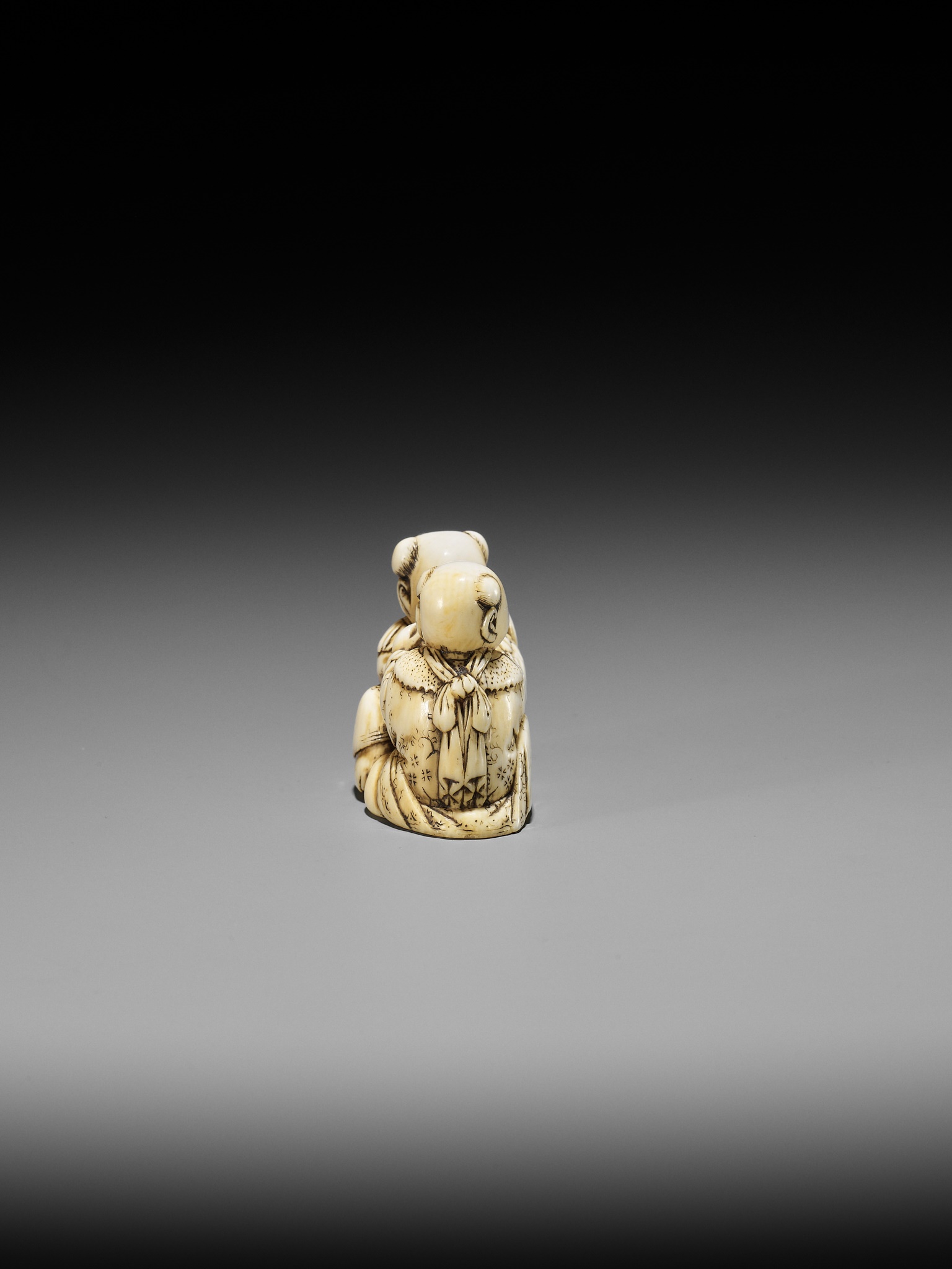 TADACHIKA: AN IVORY NETSUKE OF TWO PLAYING KARAKO - Image 6 of 10