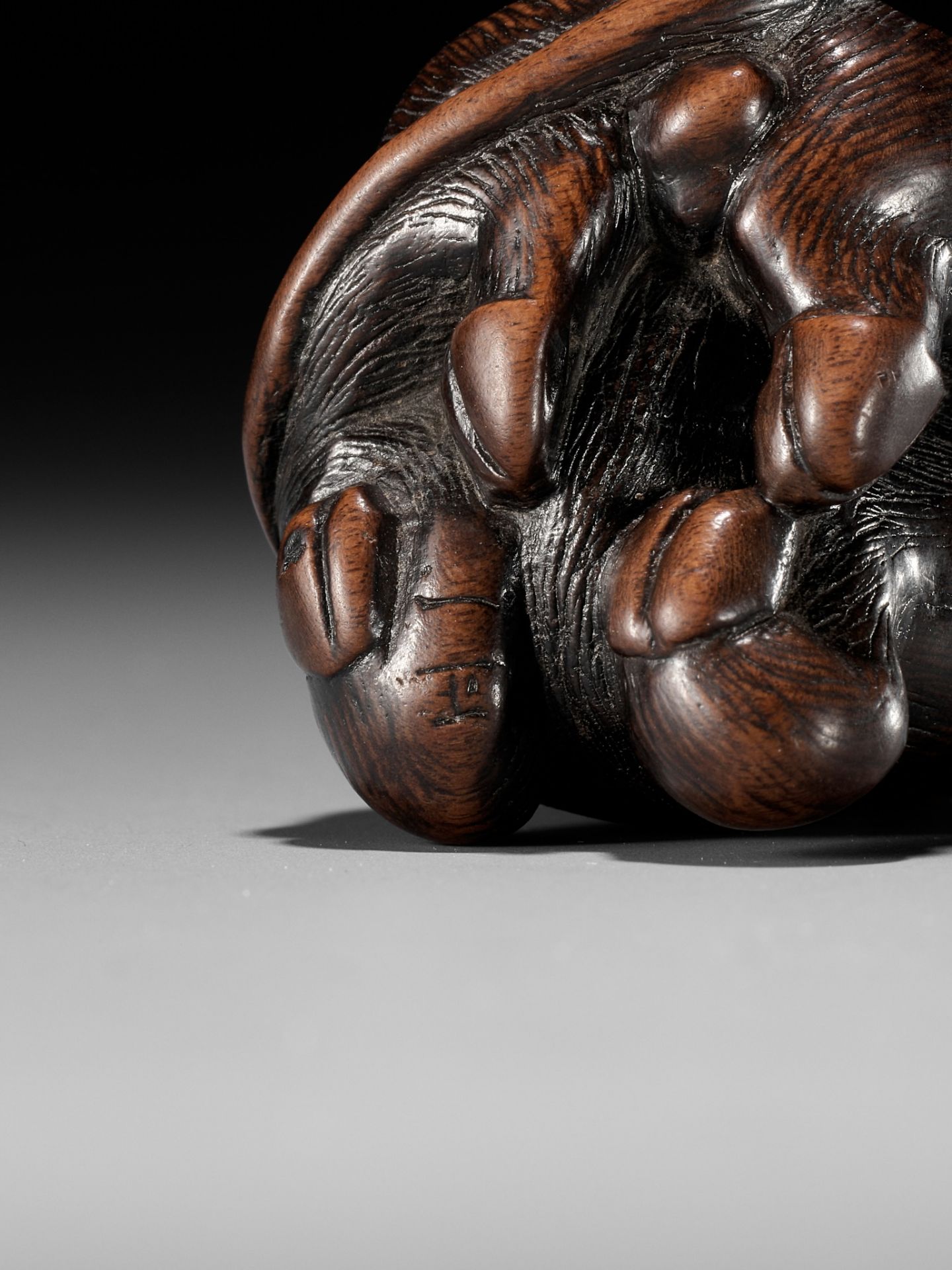 MASAKAZU: A FINE WOOD NETSUKE OF A RECUMBENT GOAT - Image 8 of 8